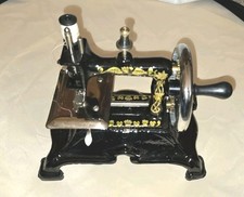 Vintage Child's Toy Sewing Machine. Beautiful Artwork- Working picture