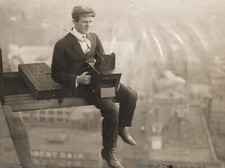 c. 1910's News Photographer Sitting on Girder of Sky Scraper Construction Photo picture