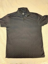Callaway Opti-Dri golf polo in black with a clean white dash pattern. picture