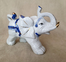 Vintage blue and white porcelain lucky circus elephant with raised trunk picture