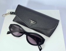 Prada PR 26ZS 16K08Z Women's Oval Sunglasses in Black with Gray Lens picture