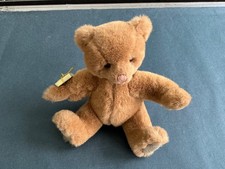 Adorable light brown Gund Teddy Bear. 7” seated lightly used. Gund label on seam picture