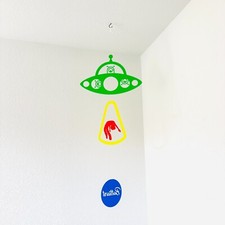 Fun UFO Encounter: Adorable Multicolor Aliens Abducting a Human in a Flying Sauc picture