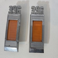 Original 69 Chevy Impala Fender Side Bezels 396 PAIR picture