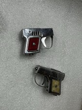 2 Collectible Lighters Japan Vintage Silvertone Guns Pistol Lighters Red Ivory picture