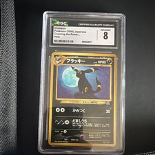 Double Swirl POKEMON CO. UMBREON 2000 CROSSING THE RUINS HOLO RARE #197 80 HP picture
