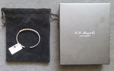 R. H. Macy's Diamond Fashion Bangle Bracelet 1/2 Cttw Bezel 14K YG Over Silver picture