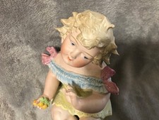 ANTIQUE CONTA & BOEHME PIANO BABY HOLDING CHERRIES  picture