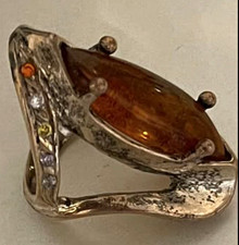 This sterling silver ring features a large marquise-cut natural Baltic amber. picture