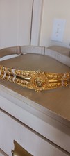 VINTAGE JUDITH LEIBER WHITE LEATHER AND GOLD ADJUSTABLE BELT WITH LION BUCKLE picture