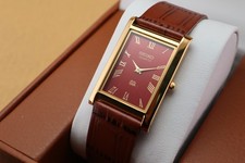 Vintage Seiko Slim Quartz Men's Wrist Watch Red Dial with Light Brown Strap. picture