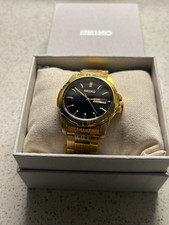 NEW Seiko Essentials Men's Quartz 39mm Gold Stainless Watch Black Dial Day/Date picture