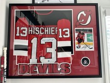 Nico Hischier Framed Auto Jersey With Signed Puck And Photo. Approx 42x32 picture