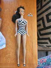 Vintage Barbies and Ken dolls. Several unopened boxes of Barbies picture
