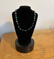 Vintage artisan-made statement necklace featuring mixed glass/stone-look beads. picture