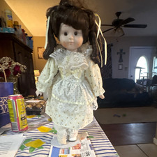 International Porcelain Girl Doll w/ Stand, Dark Brown Curly Hair. Missing shoe. picture