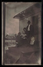 RPPC Family Portrait on Porch Winter Scene Real Photo Postcard c1910s picture