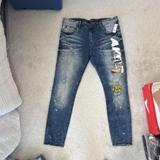 AKOO Men's Blue Medium Wash Slim Fit Paint Splatter Logo Patch Jeans 38 picture