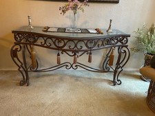 Handcrafted Iron console table with a beveled glass top. Wrought iron base. picture