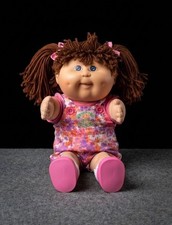 2)vintage cabbage patch kids doll and 2) furbies picture