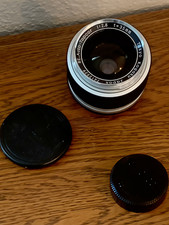 Superb Topcon RE Lens.  Auto-Topcor 35mm Lens. 1:2.8.  Leather carrying case. picture