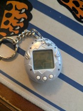 Tamagotchi Angel English Version Light Blue Silver Wings Bandai Tested Working picture