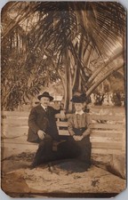 c1910s PALM BEACH, Florida Real Photo RPPC Postcard Couple on Bench / Palm Tree picture