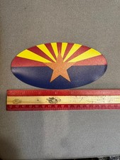 Show your Arizona pride with this premium oval Arizona flag vinyl magnet picture