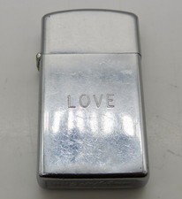 Vintage 1974 Chrome Slim Zippo Lighter - Engraved “LOVE” picture