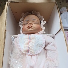 The Ashton-Drake Galleries “It's a Girl” used in the box  w/ Receiving Blanket picture