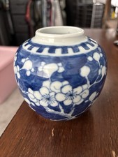 Vintage blue and white porcelain jar featuring a classic prunus blossom design. picture