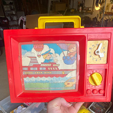 Vintage Red Plastic Wind-Up Toy TV Set w/ Changing Scene, Clock, Yellow Handle picture