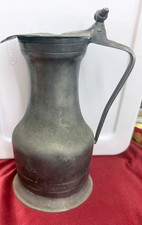 appears to be an antique 18th or 19th-century French pewter wine measur picture