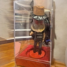 Bret Michaels signed bobblehead with shirt lettering upside down. One of a kind picture