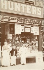BEAUTIFUL ENGLISH STOREFRONT Hunters High Class Provisions Shopkeep RPPC bhn picture