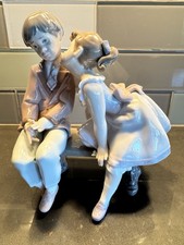 Lladro Porcelain Ten & Growing #7635 Young Girl Kissing Shy Boy on Park Bench picture