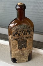 Antique Warner’s Safe Cure Bottle c 1878–1883 Amber Glass Original Label & Cork picture