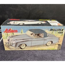 Schuco Rollfix 1085 Mercedes-Benz 220S Coupe Blue Tinplate Friction Toy Car picture