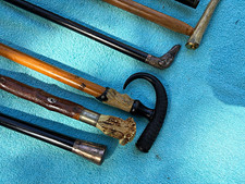 Great lot of antique shooting sticks and canes picture