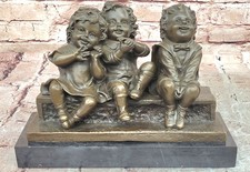 `Watching Something` Bronze Sculpture of Three Children Laughing and Sitting by picture