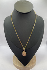 A gold- Toned Necklace with a Teardrop Shaped Peach Moonstone picture