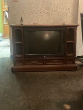 zenith floor model tv with drawers and speakers great condition screen turns on  picture